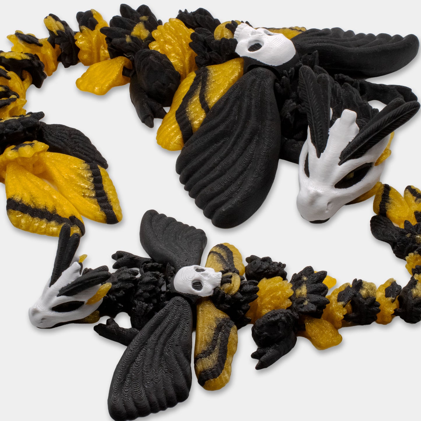 Top view of articulated Death’s Head Moth Dragons showing full body and pattern