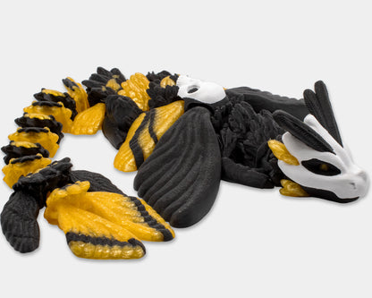 Articulated Death’s Head Moth Dragon posed on its side with tail curled